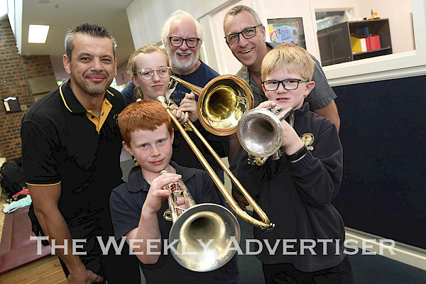 INSTRUMENTS WANTED: Ararat City Band members, back, from left, Bruno Andrade and Dave Tolputt, and Ararat Primary School teacher Matt Haddow with students Hamish Cooper, Violet Kennedy and Hayden Comrie. Junior development program leaders are on the lookout for instruments to start a student band. Picture: PAUL CARRACHER