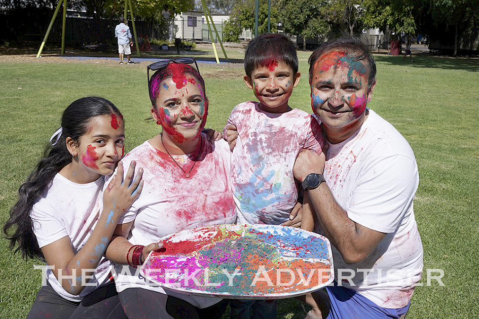 UNITED IN CELEBRATION: From left, Sammy, Sachita, Roshil and Ram Upadhyaya embrace the colours of the Holi festival at Horsham Botanic Gardens. Holi is a popular Hindu festival widely celebrated in Nepal and India. More than 20 people from Horsham Nepalese families gathered to celebrate Holi on Saturday. Ms Upadhyaya said if other people from Nepalese, Indian or other South Asian diasporas in the region were interested in celebrating the festival next year, they could contact her by emailing sachita.pudasaini@hrcc.vic.gov.au. Picture: COLIN MacGILLIVRAY