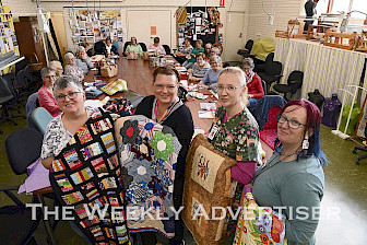 DONATION: Horsham Patchwork Quilters member Pauline Lentsment, left, donates quilts to hospice palliative care staff Nicole Miller, Jody Membrey and Katrina Fallon to deliver to patients palliating at home. Picture: PAUL CARRACHER