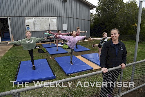 Natimuk & District Gymnastic Club level four and five girls keep up their skills outside under the eye of coach Lynette Morrow due to COVID-19 restrictions.