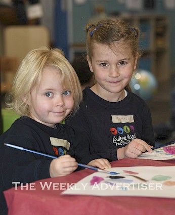 Harriet Holmes and Ellie Mills gets busy painting at Kalkee Road Kindergarten.