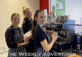 HANDS ON: Horsham Holy Trinity Lutheran College Café 3:16 elective students Jess Dufty, left, and Jaya Meadows prepare coffees with support from food technology teacher Amanda Przibilla.  Picture: ABBY WALTER