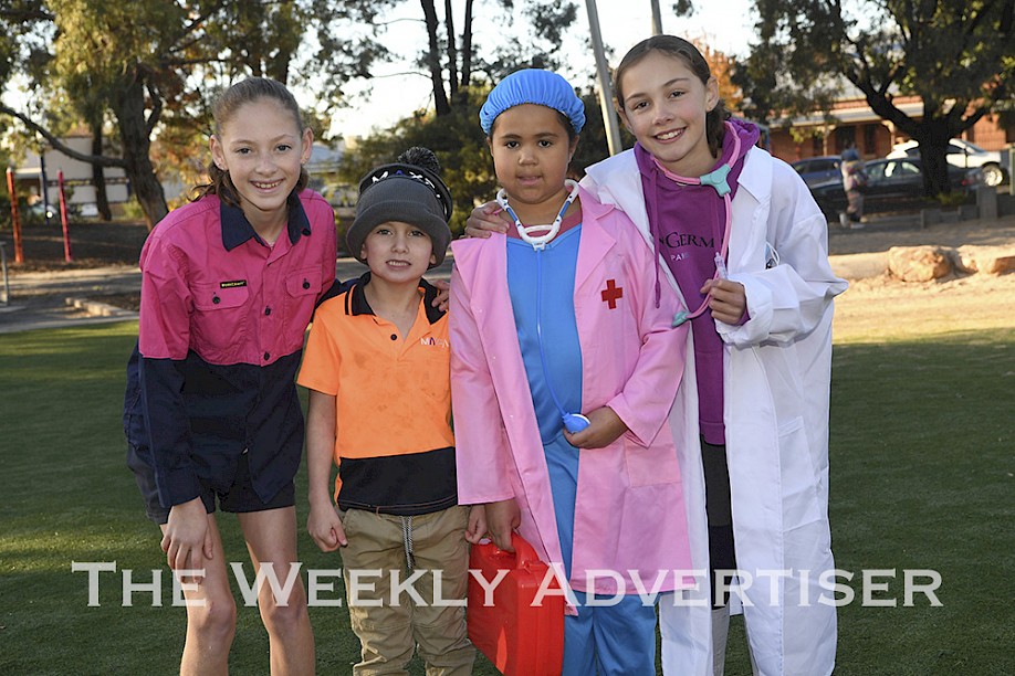 Hosham West Primary School Year 6 students Ruby Kelm, left, and Matlida Webster, right, pictured with with Reed Muller and Alana Moyo, organised a Hero Day in support of the Royal Flying Doctor Service.