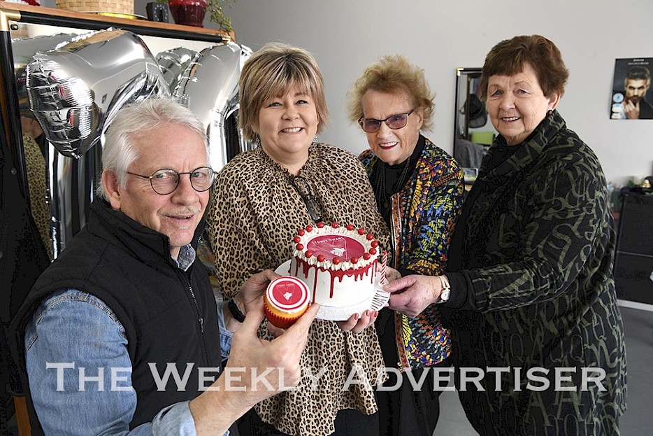 Horsham hairdresser Peter 'Pimple' Wood recieved a special birthday surprise from his customers Sheridan English, Merna Dunlop and Janice Merrett. They presented him with a Sydney Swans cake for his 70th birthday.
