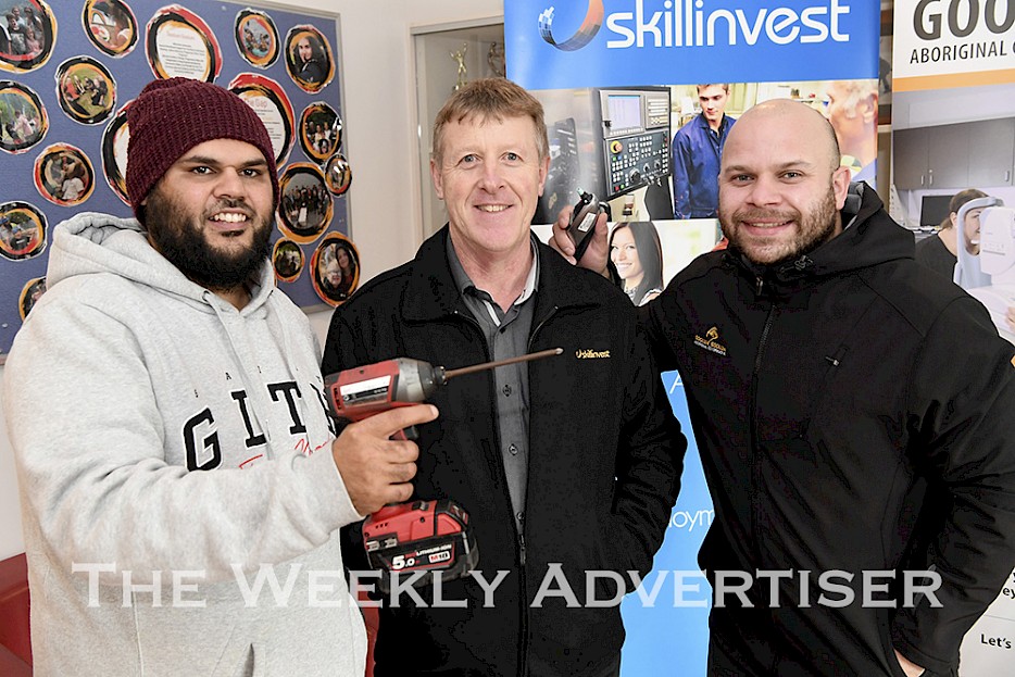 Tyson King, left, and Brian Harrison, right, with Skillinvest's Shane Cross before a Goolum Goolum Try a Trade day.