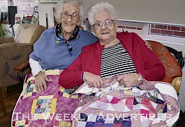 MADE WITH CARE: Garden View Court residents Joyce Hellyer and Beverley O’Brien with their gifted quilts.