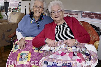 MADE WITH CARE: Garden View Court residents Joyce Hellyer and Beverley O’Brien with their gifted quilts.