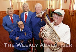 TEST RUN: Stawell City Brass Band has added a Besson Sovereign baritone horn to its instrument collection. Band member Alan Duffy tries it out as, from left, Helga Sanders, Lesley Morgan, Hugh Thompson and John Blachford watch on. Picture: PAUL CARRACHER