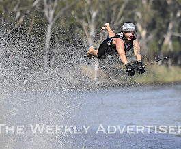 Luke Van Den Heuvel flies off the ramp in the Wimmera River during a heat of the Dimboola Water Ski Tournament and Peter Taylor Barefoot Waterski Memorial night jump on Saturday. Van Den Heuvel went on to win the night jump in front of a wowed crowd. Picture: PAUL CARRACHER