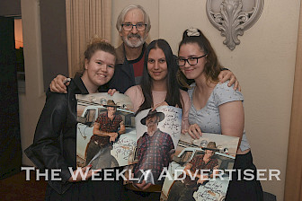 ON TOUR: Australian actor John Jarratt, promoting his film What About Sal. Fans, from left, Teimia Gooch, Kathryn Crutchfield and Kayla Collyer with posters of his iconic character Mick Taylor from Wolf Creek. Picture: PAUL CARRACHER