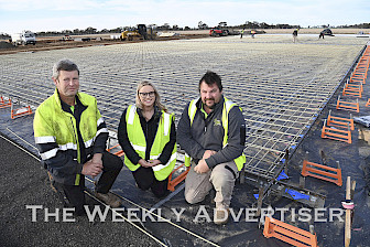 Quality Australian Hay owners Paul Johns, left, and Scott Somers, right, with employee Bec Winsall at the company’s new Warracknabeal site, which is under construction and set to open early 2025. Picture: PAUL CARRACHER