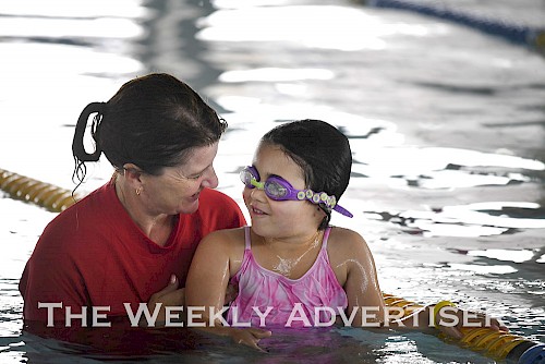 Swimming teacher Kate Farlow with Berni Del Real at YMCA intensive swimming lessons.