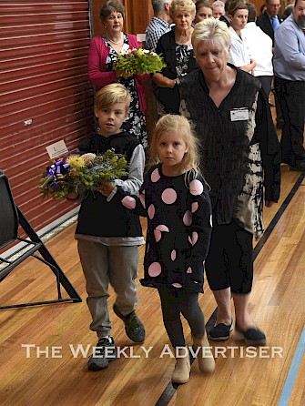 PAYING RESPECTS: Nate and Allira McInerney, with their grandmother Lynne Wright, lay a wreath in memory of their great- grandfather Bill Hutchison at a Darwin Defenders service at Horsham College’s Maroske Hall last week. The morning service gathered families of veterans, students, organisation representatives and members of the public in commemoration of historical connections between the region and the Second World War defence of Darwin. Pictures: PAUL CARRACHER