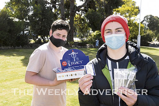 HELPING HAND: Ararat College students Darcy Aitken, left, and Sonny Kettle are pictured selling Legacy badges at the school. The COVID-19 pandemic has forced Legacy groups to cancel most face-to-face Badge Week activities. Picture: PAUL CARRACHER