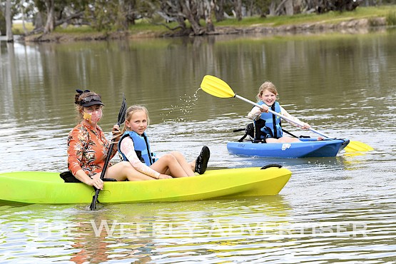 Emily Eagle, Claire Rethus and Penny Eagle enjoy a paddle on the Wimmera River near Horsham Weir.