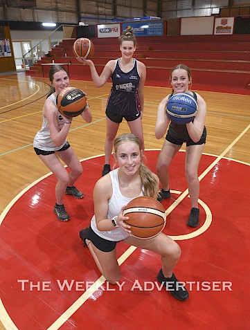 Left, Jessie Lakin, Imogen Worthy, Jemma Thomas and Olivia Brilliant, front, practicing at Horsham Basketball Stadium after COVID-19 restrictions were eased.