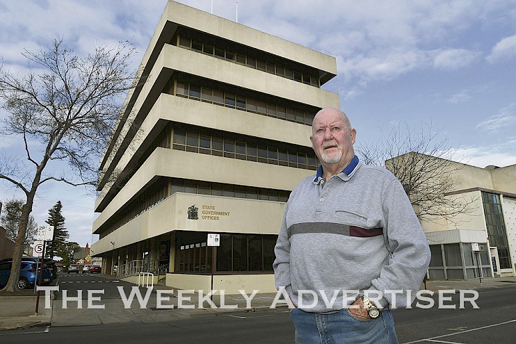 MEMORIES: Peter Creek stands outside the Horsham State Government Offices in McLachlan Street, reminiscing about his actions in helping fight a fire in the building 50 years ago. Picture: PAUL CARRACHER