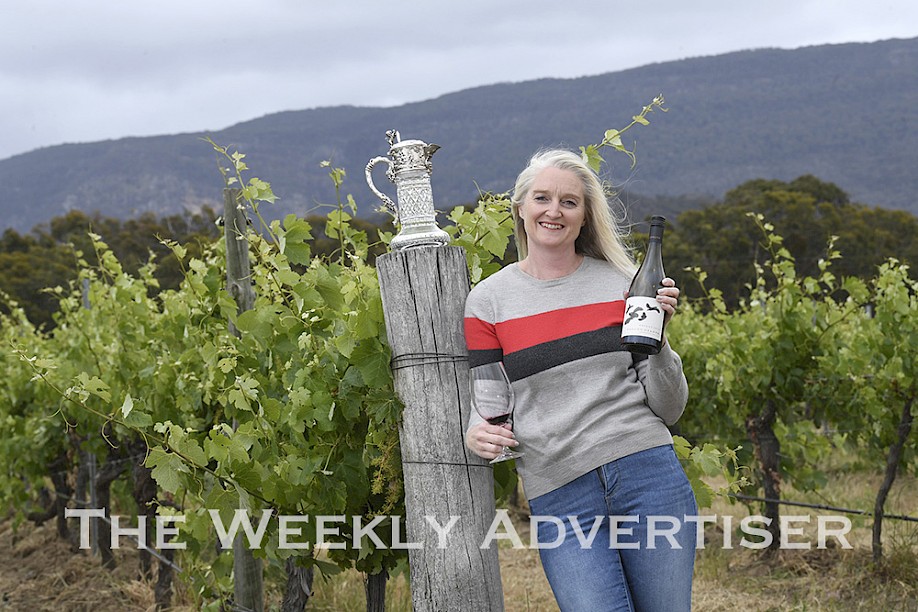 Fallen Giants owner Rebecca Drummond proudly showcases the Jimmy Watson Memorial Trophy the winery won for its 2019 shiraz, judged the best young red in Australia at Melbourne Royal Wine Awards. Picture: PAUL CARRACHER