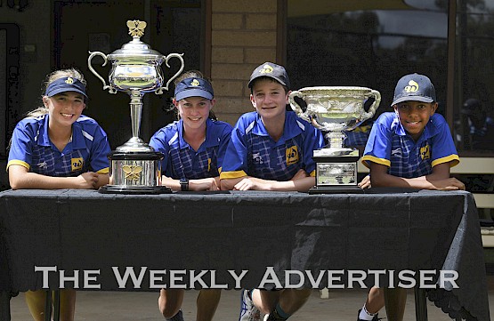 Wimmera 12 and under team Adele Joseph, Emma Streeter, Harry Allan and Eli Bailey with the Daphne Akhurst Memorial Cup and the Norman Brookes Challenge Cup at the Tennis Victoria Inter-regional Country Championships. The cups are presented to the Women's and Men's Australian Open winners.