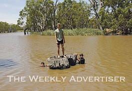 AFTERNOON OUT: From left, Regan Shaw, Cooper Mills and Zachary Jorgensen spend the afternoon swimming in the Wimmera River.  Picture: MICHAEL SCALZO